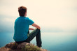 Lonely guy looking into the distance at sea
