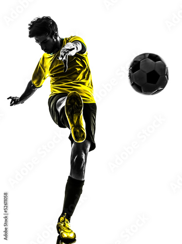 Photo: brazilian soccer football player young man kicking silhouette brazilian soccer football player young man kicking silhouette