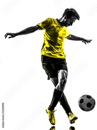 Photo: brazilian soccer football player young man dribbling silhouette brazilian soccer football player young man dribbling silhouette