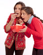 Mom and daughter eating popcorn