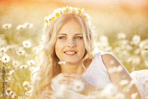 Photo: portrait of a beautiful bride in a field of daisies portrait of a beautiful bride in a field of daisies