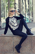 beautiful blonde girl in pullover with tiger print