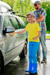 Carwash- lovely girl helping father in washcar.