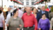 People walking down on the street defocused