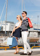 young couple in duty free shopping bags