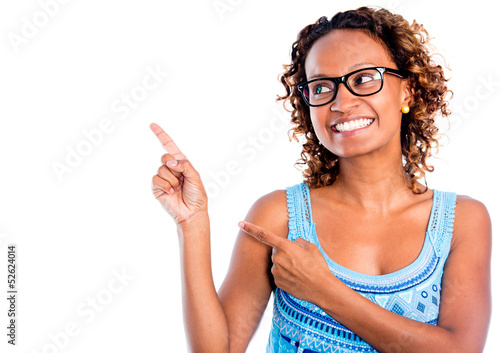 Photo: Happy woman pointing to the side - isolated over a white Happy woman pointing to the side - isolated over a white
