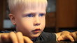 A boy plays in the computer. home furnishings 