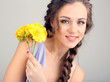 Young woman with beautiful hairstyle and flowers,