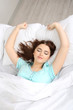 Beautiful young woman sleeping in bed