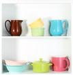 Kitchen utensils on beautiful white shelves