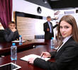 Portrait of young businesswoman in business training with her