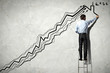 Businessman drawing graphics
