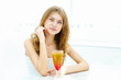Young woman with a glass of drink