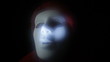 Furious scary masked man in darkness