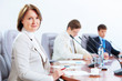 Three businesspeople at meeting