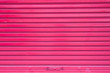 Red roller metal door surface of apartment