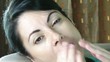 Close up of sleepy eye of a woman yawns