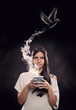 Young woman holding a cup