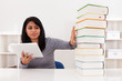 Woman Avoiding Books And Using Tablet