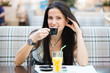 Portrait of beautiful latin woman drinking coffee
