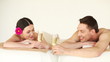 happy couple relaxing in spa salon