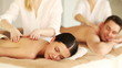 happy couple relaxing in spa salon