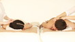 happy couple relaxing in spa salon
