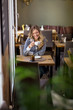 Woman Having Coffee At Cafe