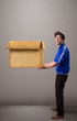 Goog-looking man holding an empty brown cardboard box