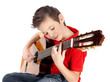 White boy is playing on acoustic guitar