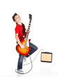 white boy sings and plays on the electric guitar