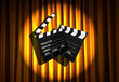 Movie clapper board against curtain