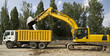 Excavator loading dumper truck