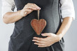 Pregnant woman belly with heart