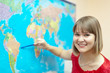 Woman showing something on world map