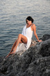 Photo: beautiful woman by the sea beautiful woman by the sea
