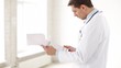 male doctor making a prescription