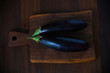 Eggplants or aubergine vegetable on a chopping board