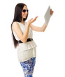 Young girl talks by tablet PC