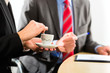 businesspeople in business office drink coffee