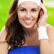 Photo: Woman exercising with fitball, outdoors Woman exercising with fitball, outdoors