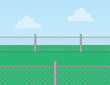 Chain linked fence in grassy field