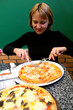 portrait of sympathetic young woman in pizzeria
