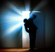 Young businessman opening door
