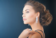 woman with diamond earrings