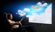 Foto: Young woman watching 3d tv Young woman watching 3d tv