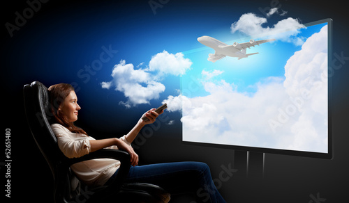 Photo: Young woman watching 3d tv Young woman watching 3d tv
