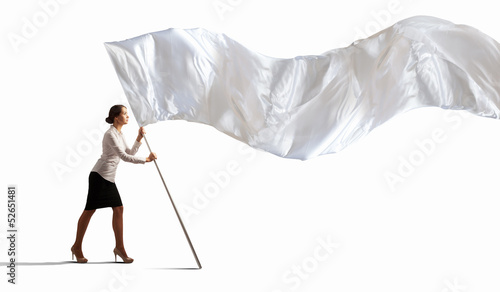 Photo: Businesswoman holding white flag Businesswoman holding white flag