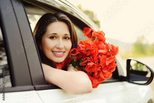 Photo: girl in car with flowers girl in car with flowers
