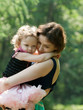 Girl and her mother are relaxing in the park